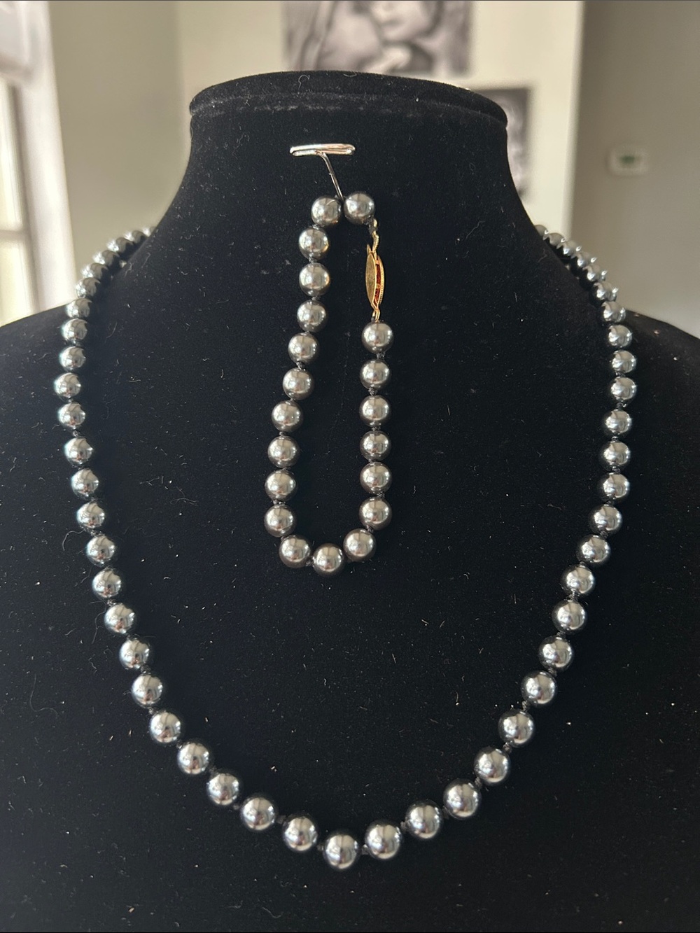 Bundle, knotted faux black pearl necklace, and bracelet.